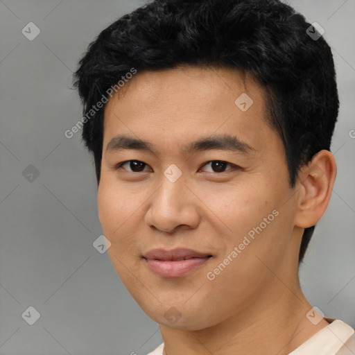 Joyful asian young-adult male with short  black hair and brown eyes