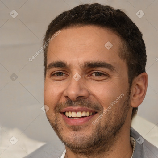 Joyful white adult male with short  brown hair and brown eyes