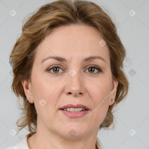 Joyful white adult female with medium  brown hair and green eyes