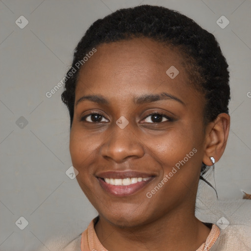 Joyful black young-adult female with medium  brown hair and brown eyes