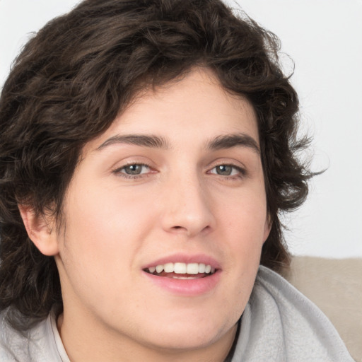 Joyful white young-adult male with medium  brown hair and brown eyes