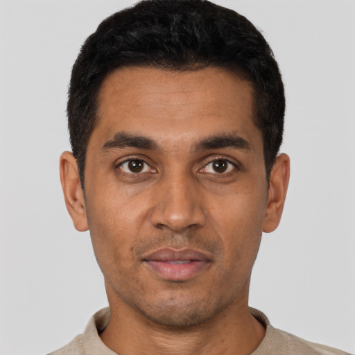 Neutral latino young-adult male with short  black hair and brown eyes
