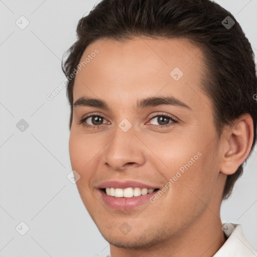 Joyful white young-adult female with short  brown hair and brown eyes