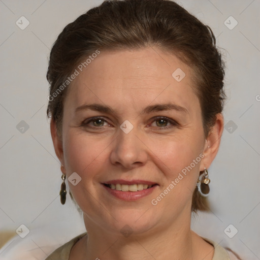 Joyful white adult female with medium  brown hair and grey eyes