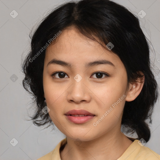 Joyful asian young-adult female with medium  black hair and brown eyes