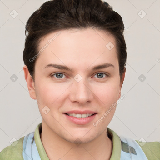 Joyful white young-adult female with short  brown hair and grey eyes