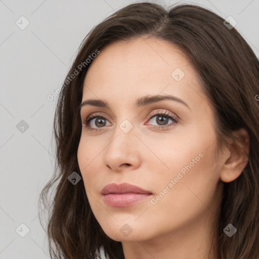 Neutral white young-adult female with long  brown hair and brown eyes