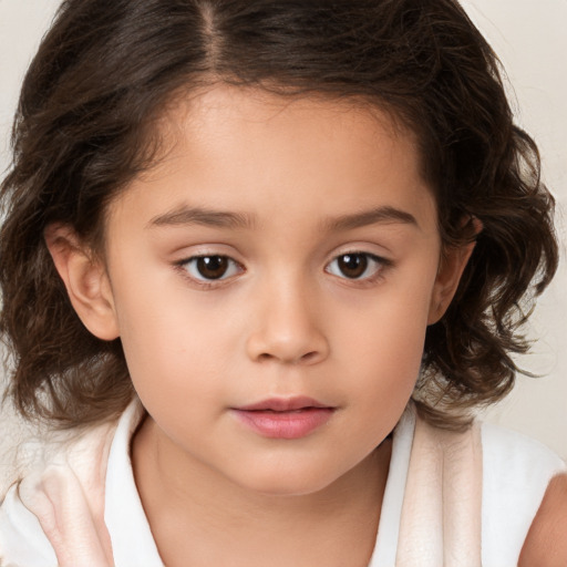 Joyful white child female with medium  brown hair and brown eyes