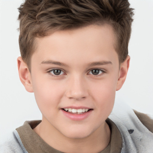 Joyful white child male with short  brown hair and brown eyes