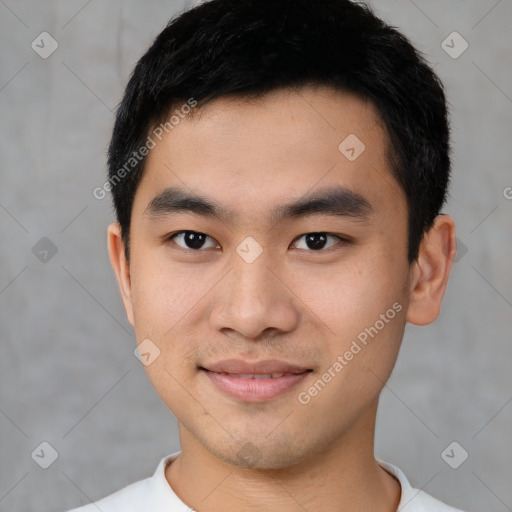 Joyful asian young-adult male with short  black hair and brown eyes