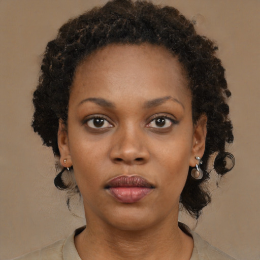 Neutral black young-adult female with medium  brown hair and brown eyes