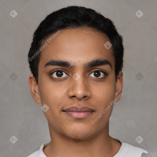 Joyful latino young-adult male with short  black hair and brown eyes