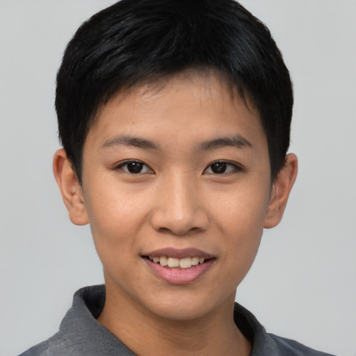 Joyful asian young-adult female with short  black hair and brown eyes
