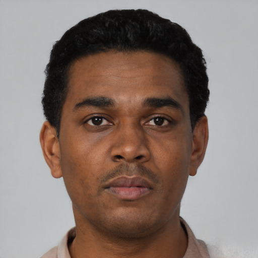 Neutral black young-adult male with short  black hair and brown eyes