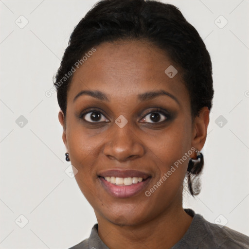 Joyful black young-adult female with short  black hair and brown eyes