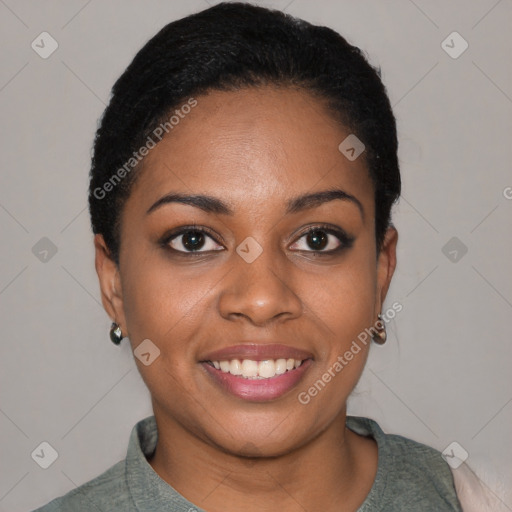 Joyful black young-adult female with short  black hair and brown eyes