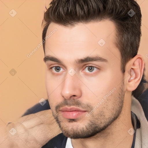 Neutral white young-adult male with short  brown hair and brown eyes