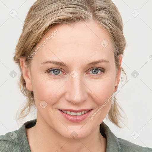 Joyful white young-adult female with medium  brown hair and blue eyes