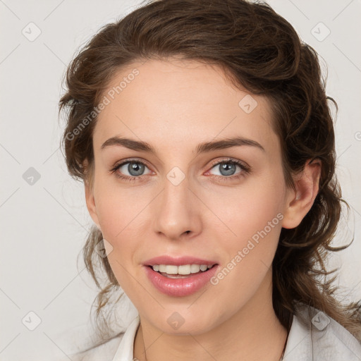 Joyful white young-adult female with medium  brown hair and blue eyes