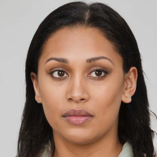 Neutral black young-adult female with long  brown hair and brown eyes