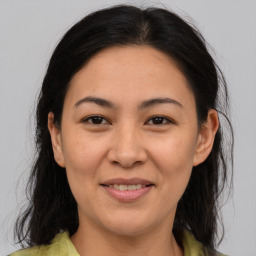 Joyful white adult female with medium  brown hair and brown eyes