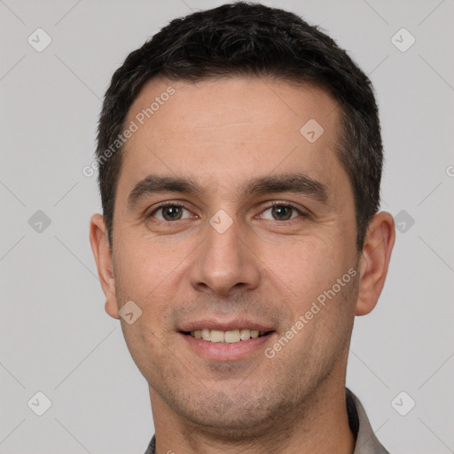 Joyful white young-adult male with short  brown hair and brown eyes