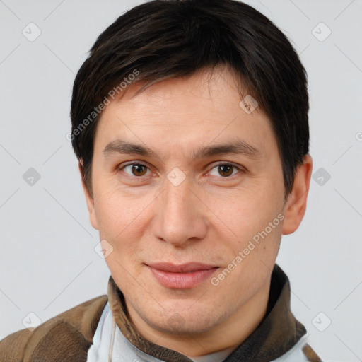 Joyful white young-adult male with short  brown hair and brown eyes