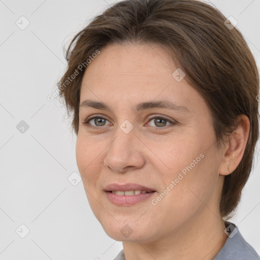 Joyful white adult female with short  brown hair and brown eyes