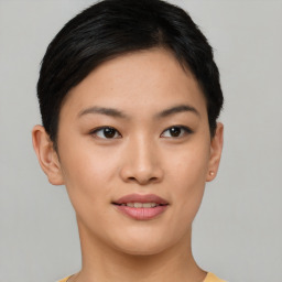 Joyful asian young-adult female with short  black hair and brown eyes