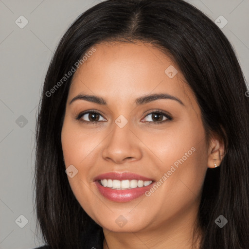 Joyful latino young-adult female with long  brown hair and brown eyes