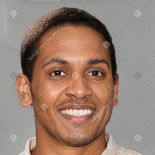 Joyful latino young-adult male with short  brown hair and brown eyes