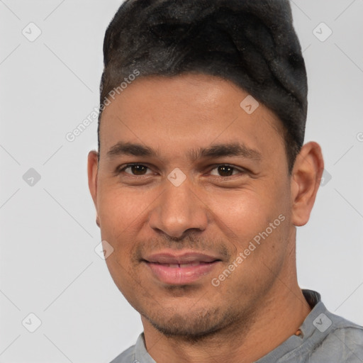 Joyful white young-adult male with short  black hair and brown eyes