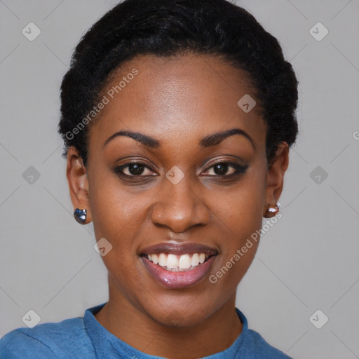 Joyful black young-adult female with short  black hair and brown eyes