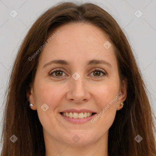 Joyful white adult female with long  brown hair and grey eyes