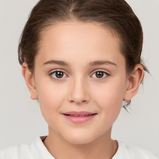 Joyful white child female with medium  brown hair and brown eyes