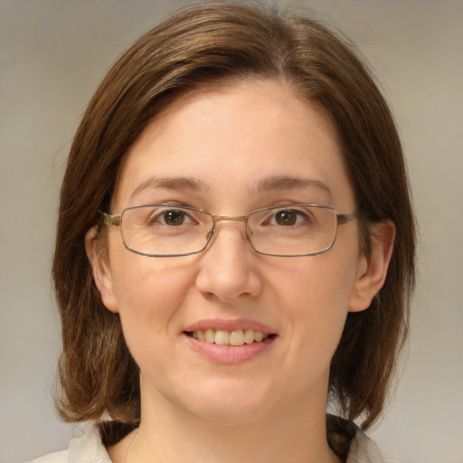 Joyful white adult female with medium  brown hair and brown eyes