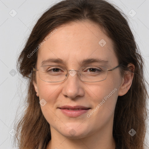 Joyful white adult female with long  brown hair and brown eyes