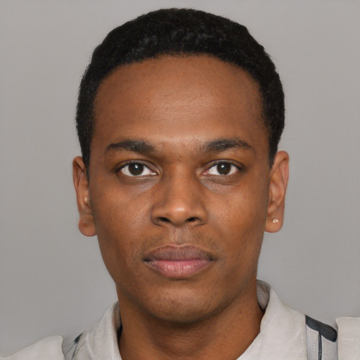 Neutral black young-adult male with short  black hair and brown eyes