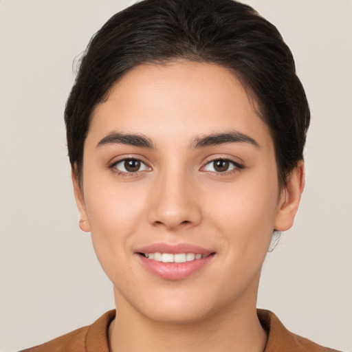 Joyful white young-adult female with short  brown hair and brown eyes