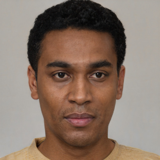 Neutral black young-adult male with short  black hair and brown eyes