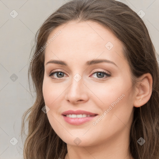 Joyful white young-adult female with long  brown hair and green eyes