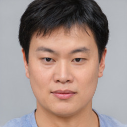 Neutral asian young-adult male with short  brown hair and brown eyes