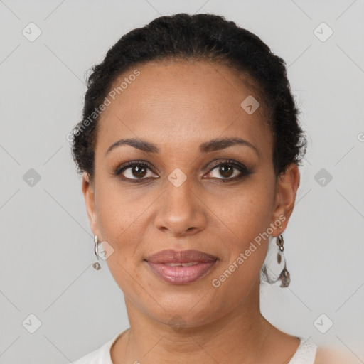 Joyful black young-adult female with short  brown hair and brown eyes