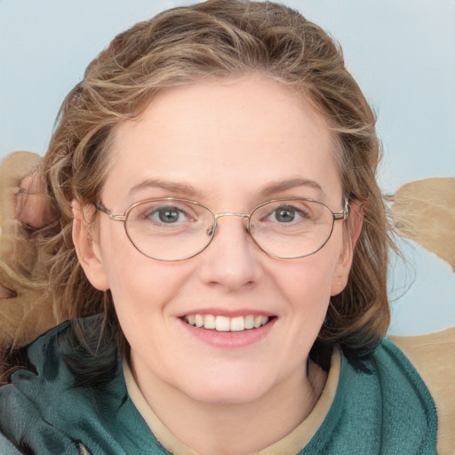 Joyful white young-adult female with medium  brown hair and blue eyes