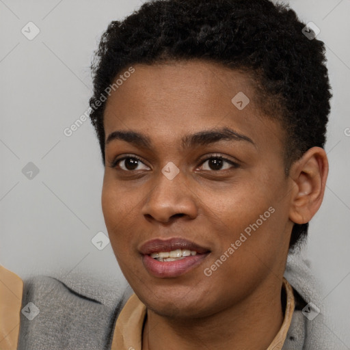 Joyful black young-adult female with short  brown hair and brown eyes