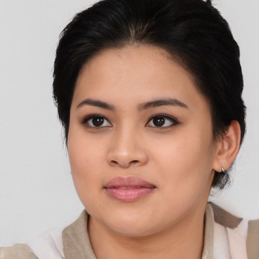 Joyful asian young-adult female with medium  black hair and brown eyes