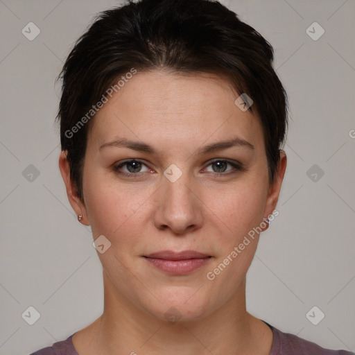 Joyful white young-adult female with short  brown hair and grey eyes