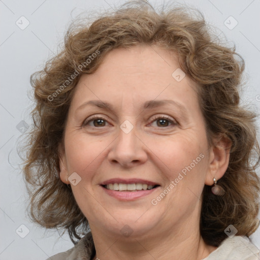 Joyful white adult female with medium  brown hair and grey eyes