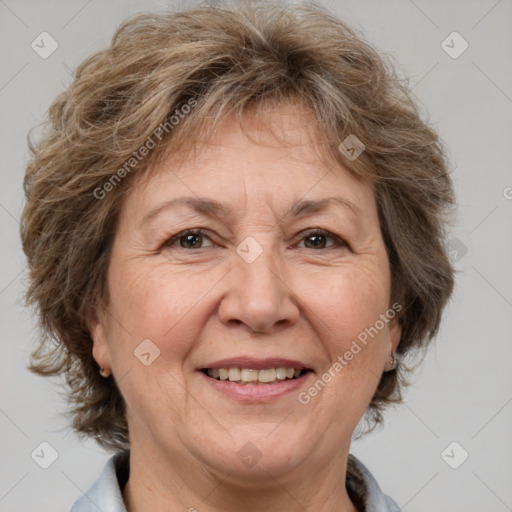 Joyful white middle-aged female with medium  brown hair and brown eyes