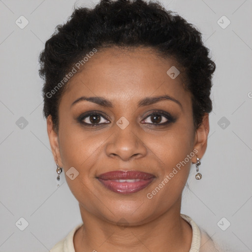 Joyful black young-adult female with short  brown hair and brown eyes